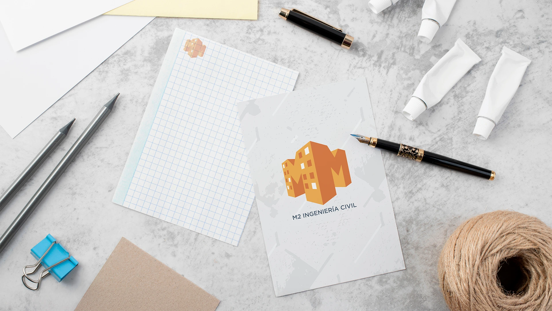 Hojas de trabajo corporativas M2 Ingeniería Civil con logo aplicado